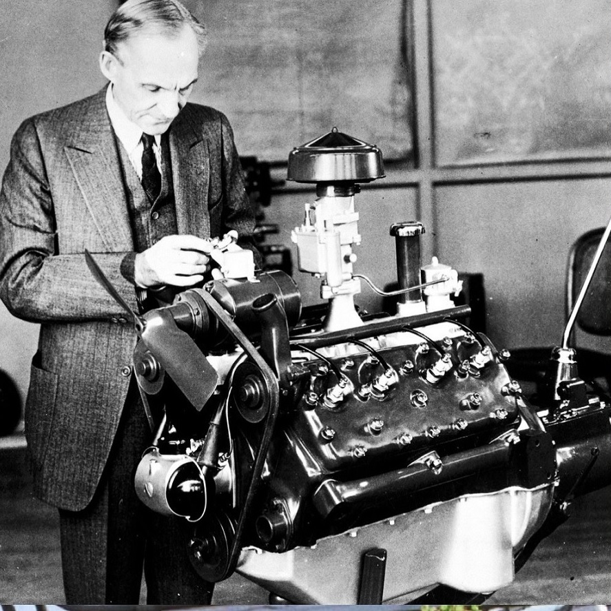 An old photo of a man inspecting a machine